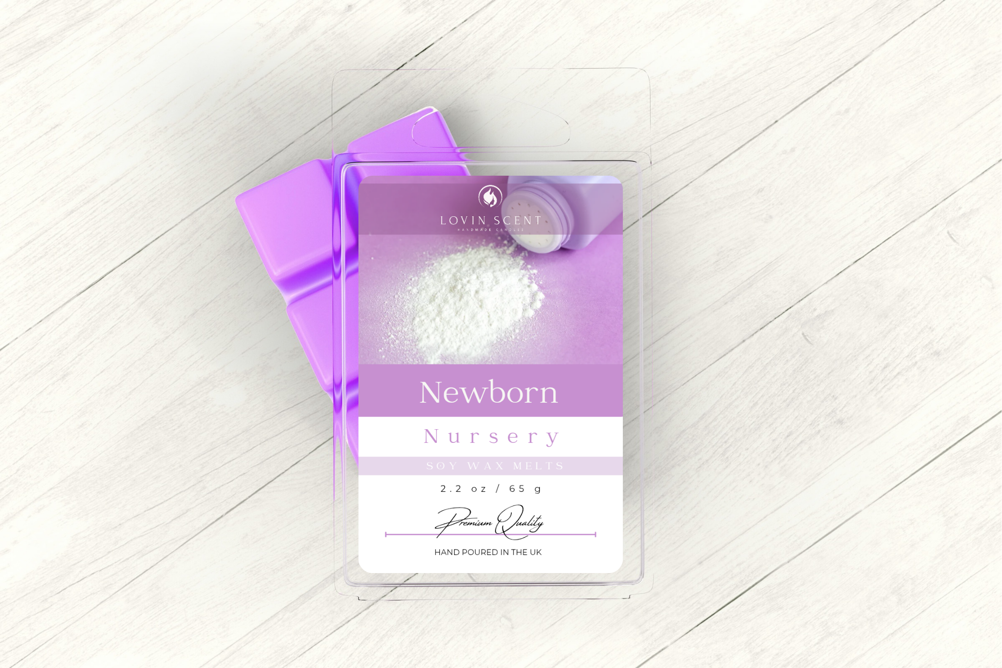 Purple packaging of 'Newborn Nurturing' on a white wooden surface
