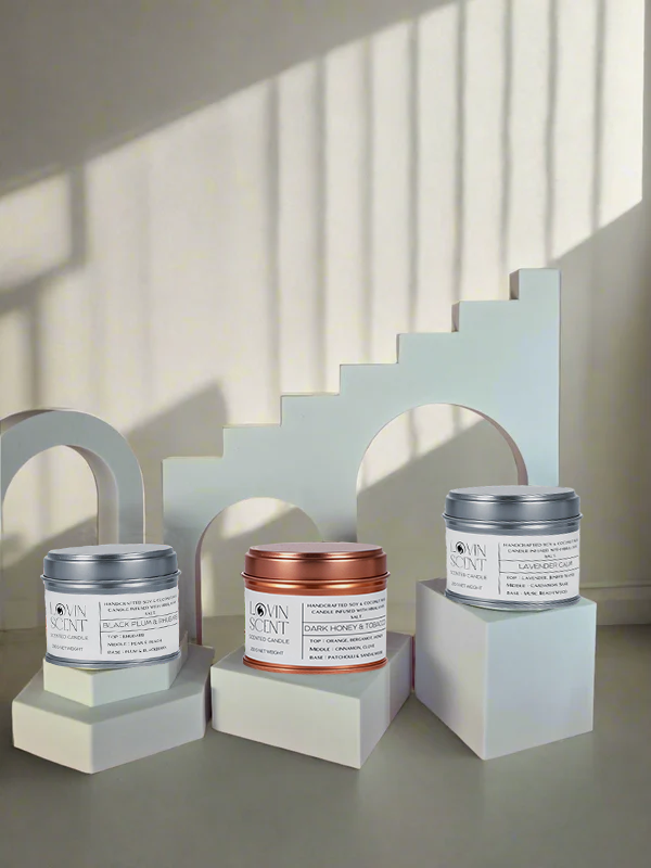 Three jars of different sizes on geometric white blocks with a neutral background