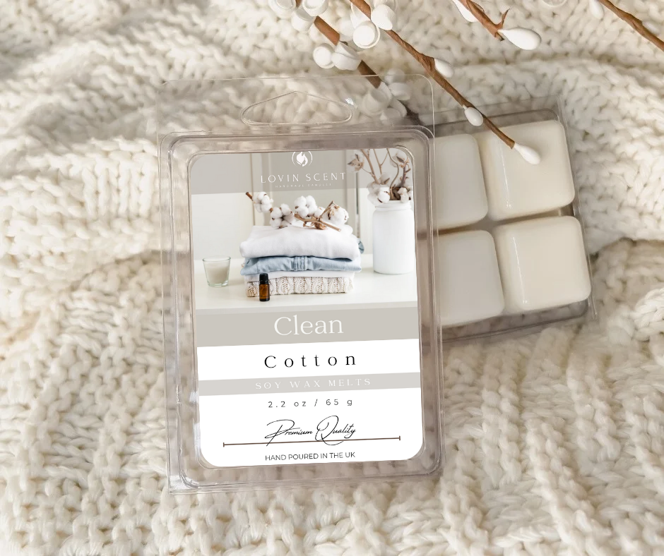 Packaged wax melts labeled 'Clean Cotton' on a textured white surface.