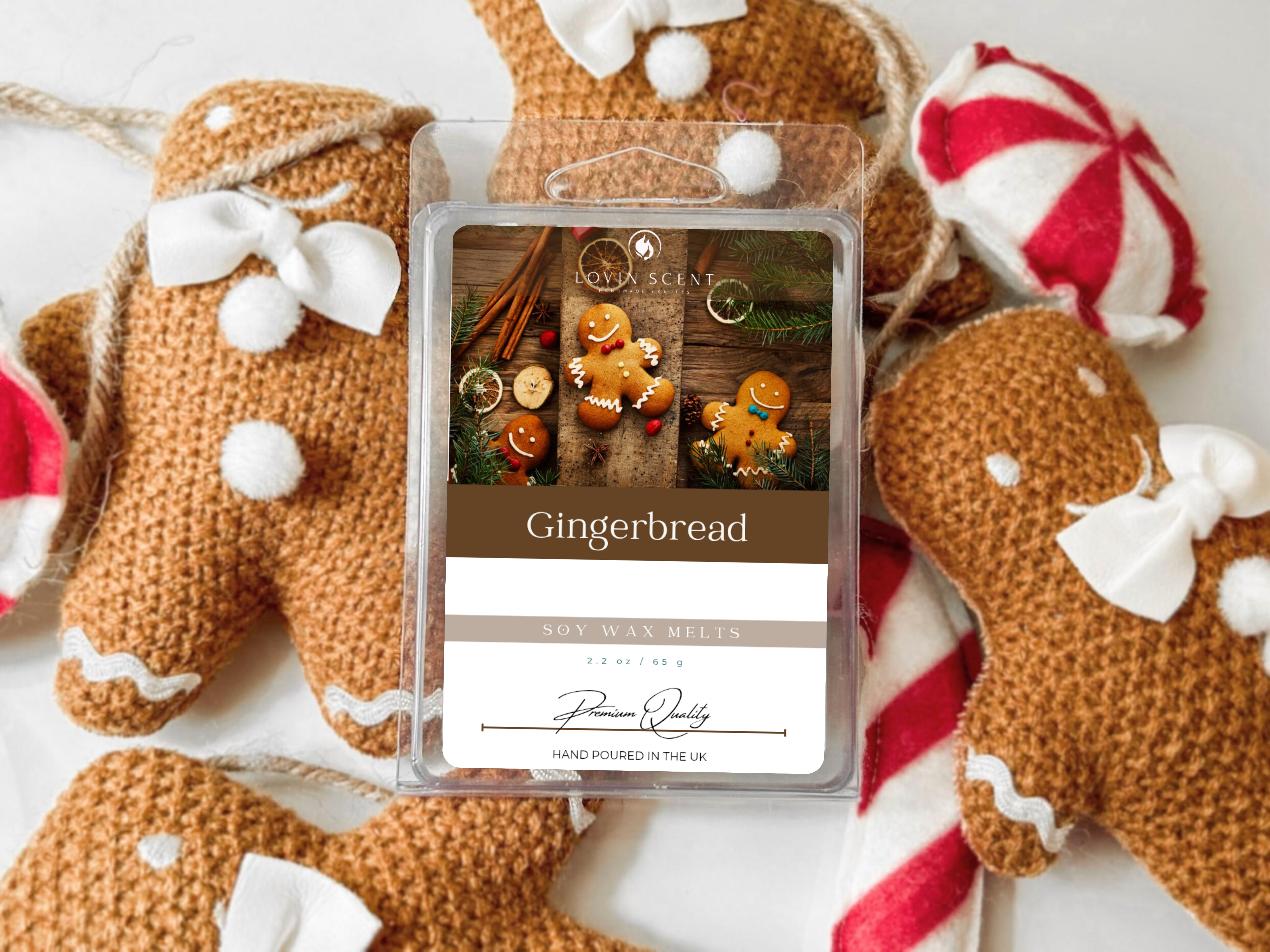 Gingerbread-themed wax melt packaging with decorative gingerbread cookies in the background.