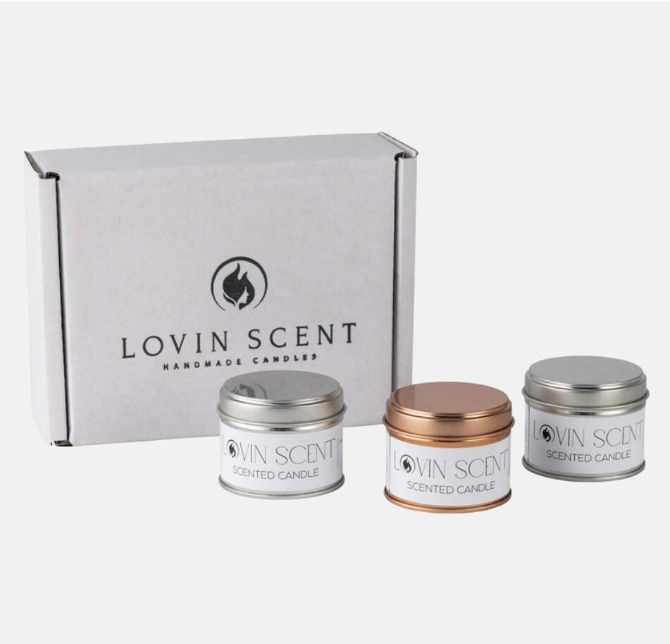 Set of Lovin Scent candles with a branded box on a white background