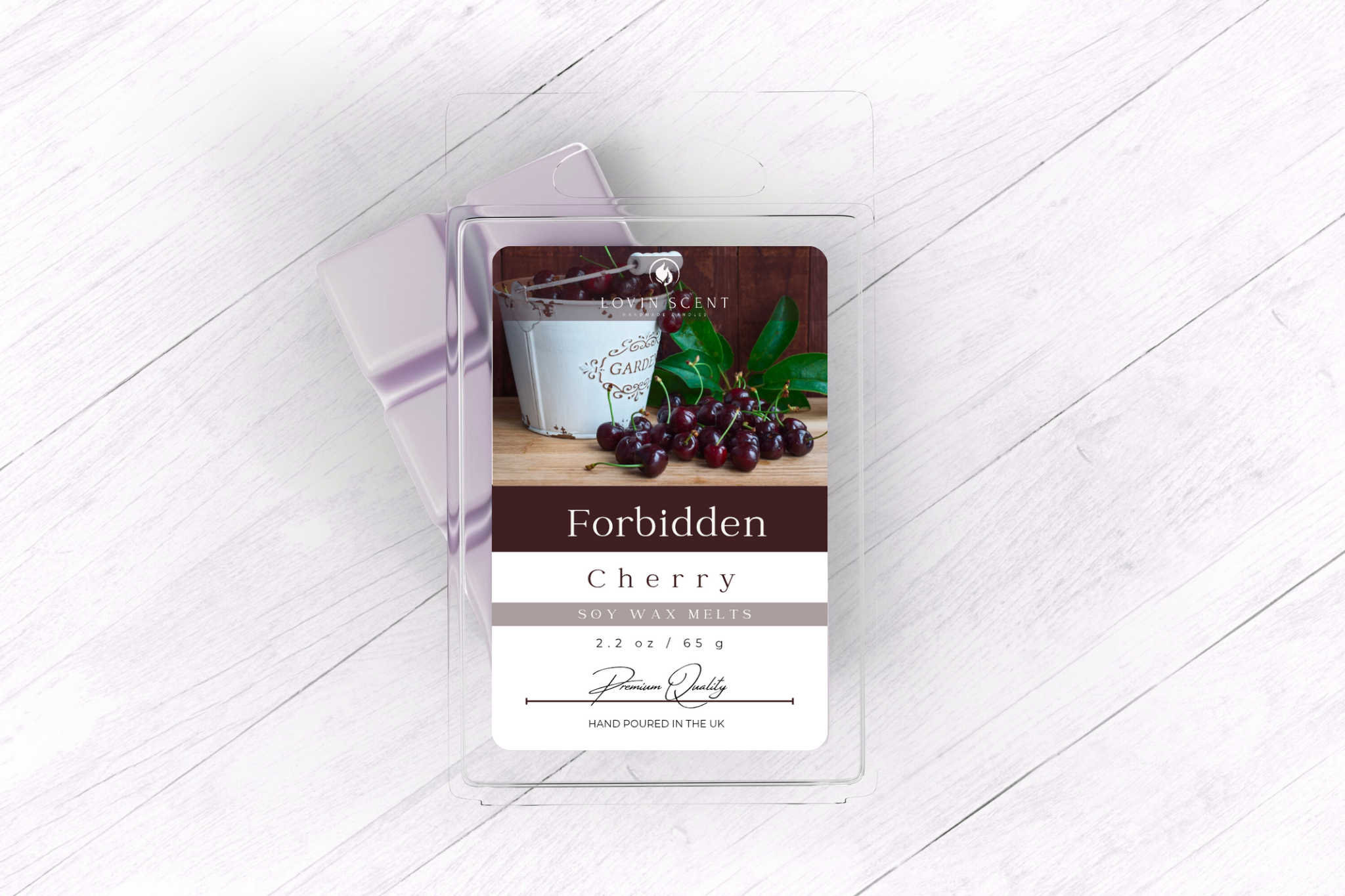 Packaged product labeled 'Forbidden Cherry' on a white wooden surface