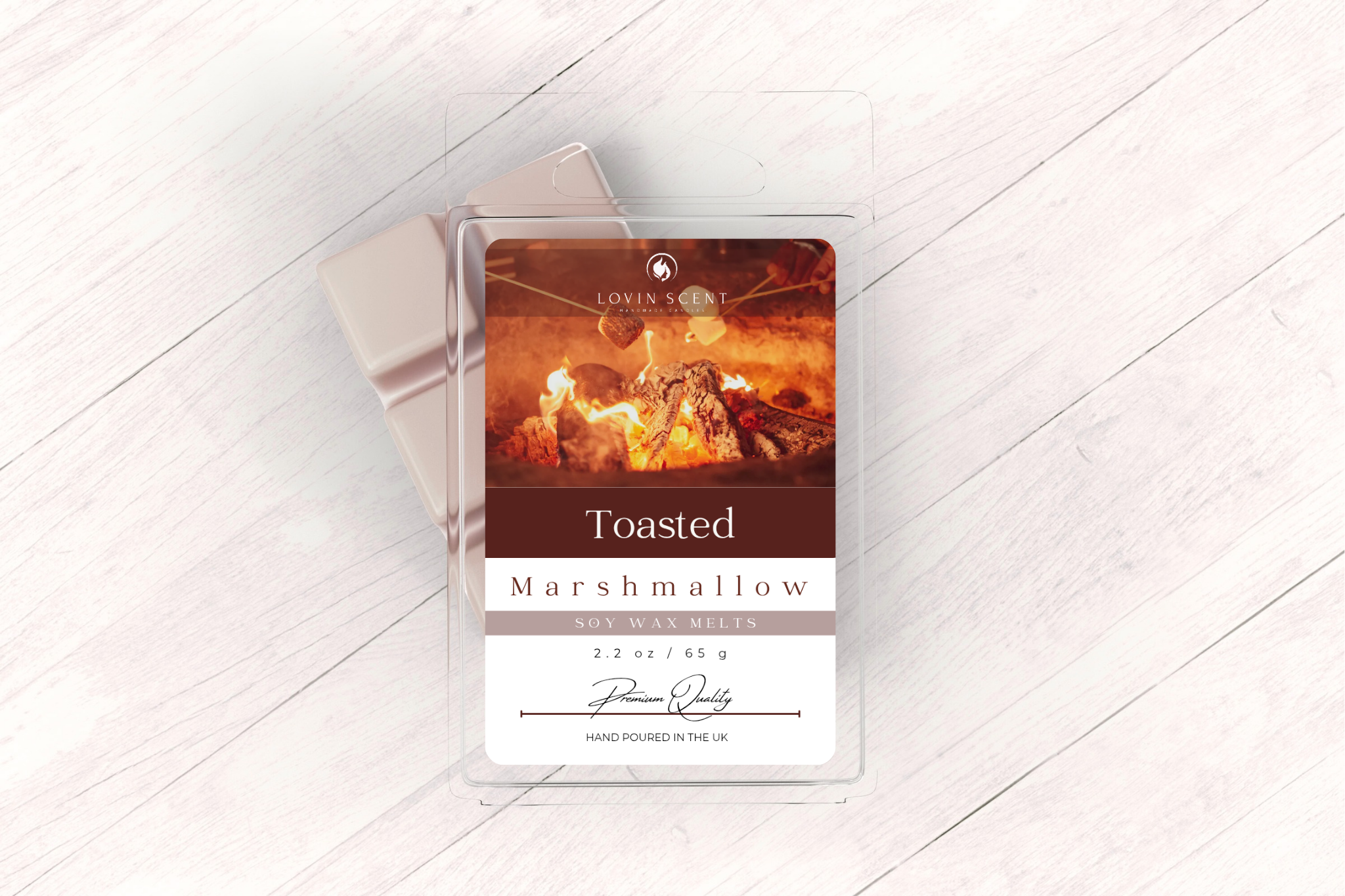 Wax melt packaging labeled 'Toasted Marshmallow' on a light wooden surface