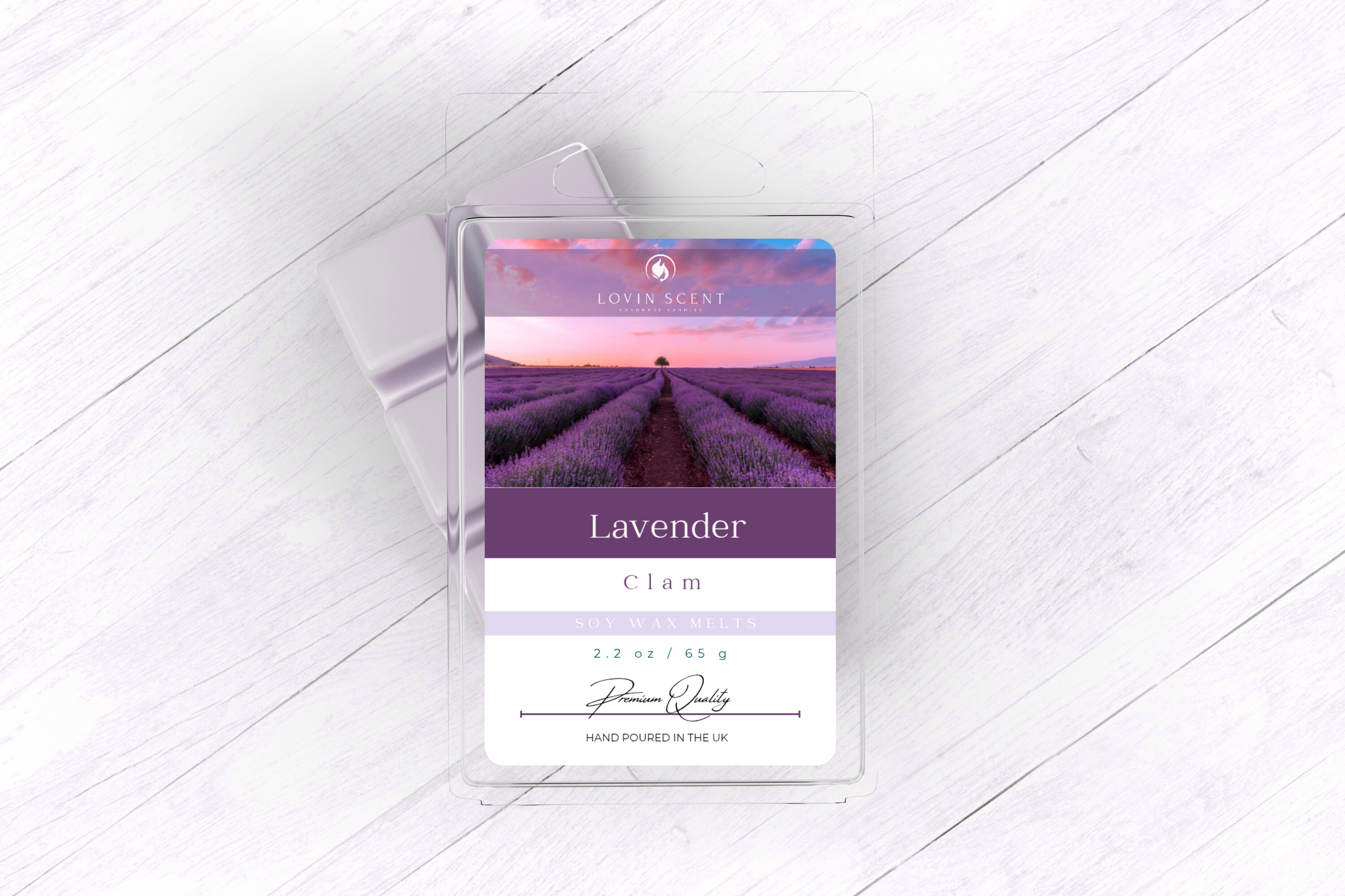 Lavender candle packaging with scenic design on a white wooden surface