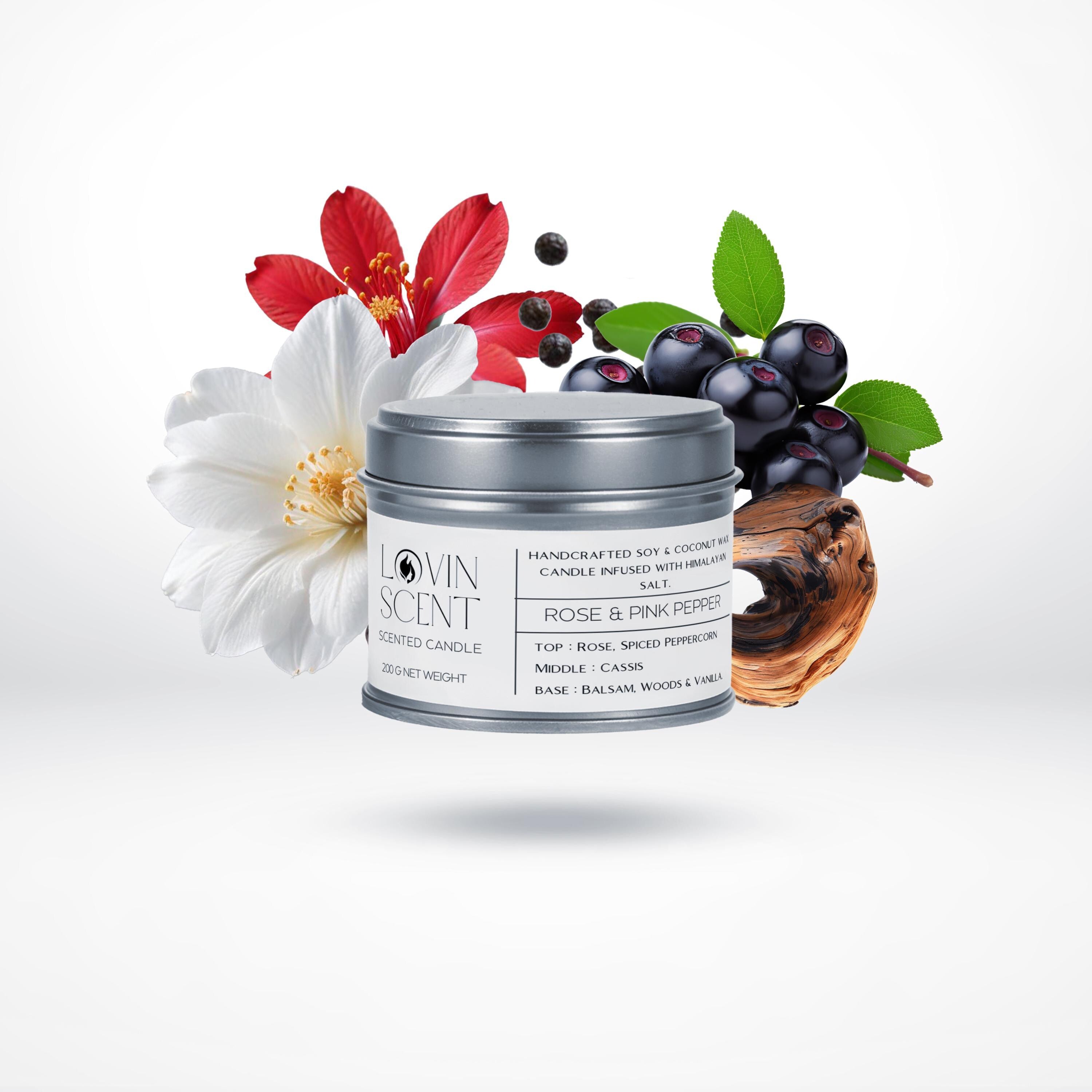 Candle with floral and fruit elements on a white background